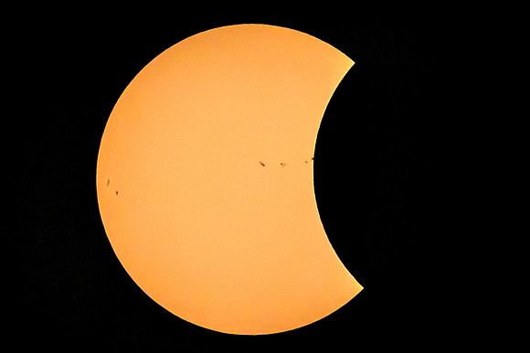 Moon Eclipsing the Spotted Sun