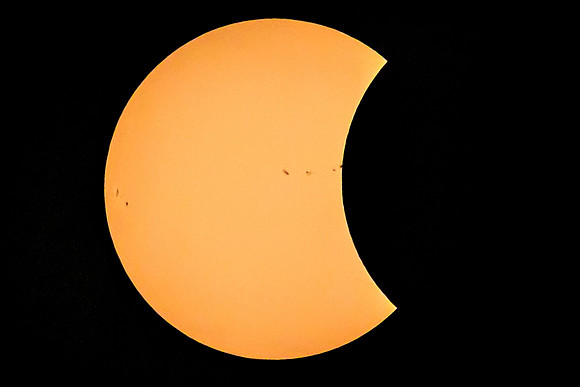 Moon Eclipsing the Spotted Sun